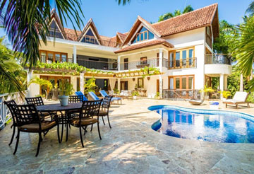 Stunning tennis residence in prestigious gated beachfront community