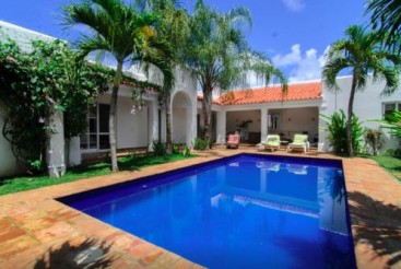 Perfect tropical oasis with pool inside gated beachfront community